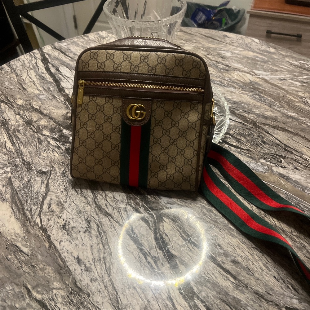 Designer messenger bag lightly used a few times. Great condition